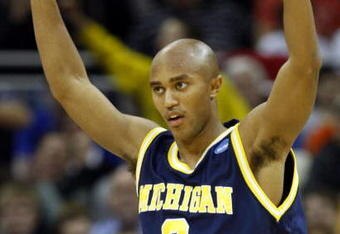 KANSAS CITY, MO - MARCH 19:  C.J. Lee #2 of the Michigan Wolverines reacts after a three-point scoring play in the second half against the Clemson Tigers during the first round of the NCAA Division I Men's Basketball Tournament at the Sprint Center on March 19, 2009 in Kansas City, Missouri. The Wolverines defeated the Tigers 62-59. (Photo by Jamie Squire/Getty Images)
