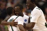 MINNEAPOLIS - MARCH 22:  (L-R) Kalin Lucas #1, Travis Walton #5 and Draymond Green #23 of the Michigan State Spartans celebrate after their 74-69 win against the USC Trojans during the second round of the NCAA Division I Men's Basketball Tournament at the Hubert H. Humphrey Metrodome on March 22, 2009 in Minneapolis, Minnesota.  (Photo by Jonathan Daniel/Getty Images)