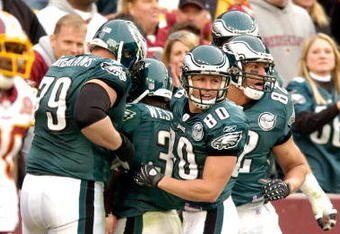 LANDOVER, MD - NOVEMBER 11:  Brian Westbrook #36 of the Philadelphia Eagles is congratulated by teammates after scoring on a 57 yard pass play against the Washington Redskins November 11, 2007 at FedEx Field in Landover, Maryland.  (Photo by Greg Fiume/Getty Images)