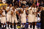 PHILADELPHIA - MARCH 21:  Kemba Walker #15, Jonathan Mandeldove #32, A.J. Price #12,  Stanley Robinson #21, Jeff Adrien #4 and Hasheem Thabeet #34 of the Connecticut Huskies show camaraderie for their team during the game against the Texas A&M Aggies during the second round of the NCAA Division I Men's Basketball Tournament at the Wachovia Center on March 21, 2009 in Philadelphia, Pennsylvania.  The Huskies defeated the Aggies 92-66.  (Photo by Jim McIsaac/Getty Images)