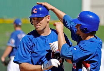 SURPRISE, AZ - FEBRUARY 27:  Micah Hoffpauir #6 (L) of the Chicago Cubs is congratulated by teammate Ryan Theriot #2 who scored on Hoffpauir's two-run home run against the Texas Rangers during a spring training game at the Surprise Stadium on February 27, 2009 in Surprise, Arizona.  (Photo by Kevork Djansezian/Getty Images)