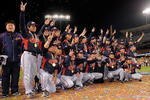 LOS ANGELES, CA - MARCH 23:  Japan players pose for photos after defeating Korea during the finals of the 2009 World Baseball Classic on March 23, 2009 at Dodger Stadium in Los Angeles, California. Japan won 5-3 in 10 innings.  (Photo by Mark J. Terrill-Pool/Getty Images)