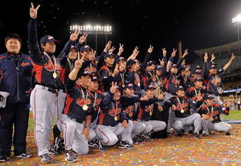 LOS ANGELES, CA - MARCH 23:  Japan players pose for photos after defeating Korea during the finals of the 2009 World Baseball Classic on March 23, 2009 at Dodger Stadium in Los Angeles, California. Japan won 5-3 in 10 innings.  (Photo by Mark J. Terrill-Pool/Getty Images)