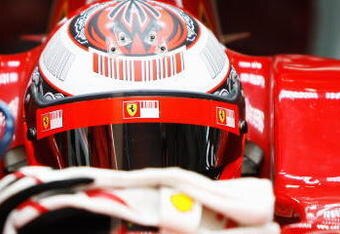 SAKHIR, BAHRAIN - FEBRUARY 17:  Kimi Raikkonen of Finland and Ferrari looks on from his cockpit during Formula One testing ahead of the 2009 Formula One season at the Bahrain International Circuit on February 17, 2009 in Sakhir, Bahrain.  (Photo by Paul Gilham/Getty Images)