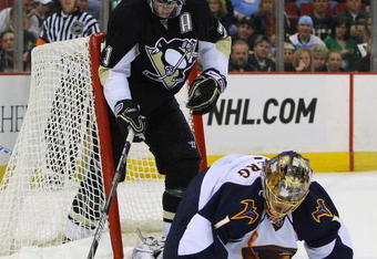 PITTSBURGH - MARCH 17: Evgeni Malkin #71 of the Pittsburgh Penguins is backed into by Johan Hedberg #1 of the Atlanta Thrashers at the Mellon Arena March 17, 2009 in Pittsburgh, Pennsylvania. The Penguins defeated the Thrashers 6-2. (Photo by Bruce Bennett/Getty Images)