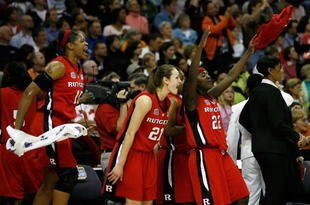 CLEVELAND - APRIL 01: (L-R) Kia Vaughn #15, Heather Zurich #21 and Matee Ajavon #22 of the Rutgers Scarlet Knights celebrate from the bench late inthe game against the LSU Lady Tigers during the National Semifinal game of the 2007 NCAA Women's Final Four at the Quicken Loans Arena on April 1, 2007 in Cleveland, Ohio. Rutgers won 59-35. (Photo by Gregory Shamus/Getty Images)
