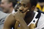 CLEVELAND - APRIL 21:  Gilbert Arenas #0 of the Washington Wizards looks on from the bench late in the game while playing the Cleveland Cavaliers in Game Two of the Eastern Conference Quarterfinals during the 2008 NBA Playoffs at Quicken Loans Arena April 21, 2008 in Cleveland, Ohio. Cleveland won the game 116-86. NOTE TO USER: User expressly acknowledges and agrees that, by downloading and or using this photograph, User is consenting to the terms and conditions of the Getty Images License Agreement.  (Photo by Gregory Shamus/Getty Images)