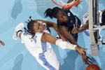 CHAPEL HILL, NC - JANUARY 19:  Tina Charles #31 of the Connecticut Huskies moves for the rebound against Chay Shegog #20 of the North Carolina Tar Heels during the game on January 19, 2009 at the Dean E. Smith Center in Chapel Hill, North Carolina.  (Photo by Kevin C. Cox/Getty Images)