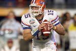 MIAMI - JANUARY 08:  Quarterback Tim Tebow #15 of the Florida Gators moves to pass the ball during the FedEx BCS National Championship Game against the Oklahoma Sooners at Dolphin Stadium on January 8, 2009 in Miami, Florida.  (Photo by Donald Miralle/Getty Images)
