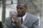 LEBANON - JANUARY 14: New York Giants wide receiver Plaxico Burress warms his hands as he arrives at the Lebanon County Courthouse January 14, 2009 in Lebanon, Pa.  Burress is scheduled to appear in a civil trial in a dispute with an automobile dealer over what he owes in damages to a vehicle supplied to him by the dealership. (Photo by Chris Gardner/Getty Images)