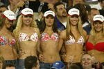 SYDNEY - OCTOBER 6:  Swimsuit fans including Jennifer Hawkins of Australia (second from right who went on to become Miss Universe 2004) show their wares during the 2002 NRL Grand Final played between the Sydney Roosters and the New Zealand Warriors held at Telstra Stadium in Sydney, Australia on October 6, 2002. The Roosters defeated the Warriors 30-8. (Photo by Adam Pretty/Getty Images)