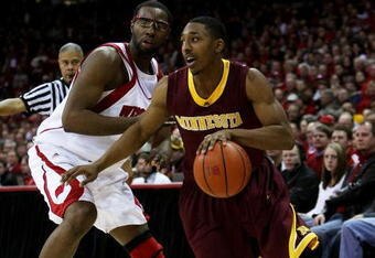 MADISON, WI - JANUARY 15: Al Nolen #0 of the Minnesota Golden Gophers drvies around Marcus Landry #1 of the Wisconsin Badgers on January 15, 2009 at the Kohl Center in Madison, Wisconsin. Minnesota defeated Wisconsin 78-74 in overtime. (Photo by Jonathan Daniel/Getty Images)