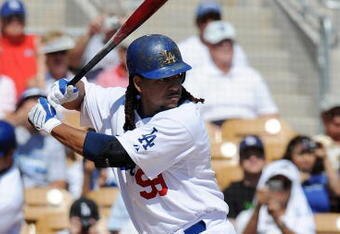 GLENDALE, AZ - MARCH 13:   Manny Ramirez #99 of the Los Angeles Dodgers at bat during a Spring Training game against the Texas Rangers on March 13, 2009 at Camelback Ranch in Glendale, Arizona.  (Photo by Lisa Blumenfeld/Getty Images)