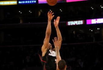 LOS ANGELES - MARCH 17:  Andre Iguodala #9 of the the Philadelphia 76ers makes a three point basket at the final buzzer over Trevor Ariza #3 of the Los Angeles Lakers to win the game on March 17, 2009 at Staples Center in Los Angeles, California.  he 76ers won 94-93.   NOTE TO USER: User expressly acknowledges and agrees that, by downloading and/or using this Photograph, user is consenting to the terms and conditions of the Getty Images License Agreement. (Photo by Stephen Dunn/Getty Images)