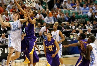 GREENSBORO, NC - MARCH 21:  Tyler Hansbrough #50 of the North Carolina Tar Heels shoots against Chris Johnson #21 of the Louisiana State University Tigers during the second round of the NCAA Division I Men's Basketball Tournament at the Greensboro Coliseum on March 21, 2009 in Greensboro, North Carolina.  (Photo by Streeter Lecka/Getty Images)
