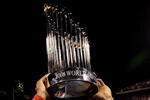 PHILADELPHIA - OCTOBER 29:  Jimmy Rollins #11 of the Philadelphia Phillies celebrates with the World Series Championship trophy after their 4-3 win against the Tampa Bay Rays during the continuation of game five of the 2008 MLB World Series on October 29, 2008 at Citizens Bank Park in Philadelphia, Pennsylvania.  (Photo by Pool/Getty Images)