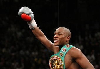 LAS VEGAS - DECEMBER 08:  Floyd Mayweather Jr. celebrates his 10th round knockout of Ricky Hatton of England after their WBC world welterweight championship fight at the MGM Grand Garden Arena on December 8, 2007 in Las Vegas, Nevada.  (Photo by Al Bello/Getty Images)