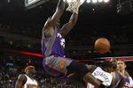 OAKLAND, CA - MARCH 15:  Shaquille O'Neal #32 of the Phoenix Suns dunks over Kelenna Azubuike #7 of the Golden State Warriors during an NBA game on March 15, 2009 at Oracle Arena in Oakland, California. NOTE TO USER: User expressly acknowledges and agrees that, by downloading and or using this photograph, User is consenting to the terms and conditions of the Getty Images License Agreement.  (Photo by Jed Jacobsohn/Getty Images)