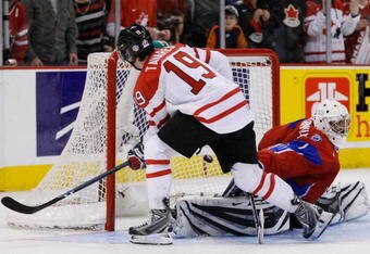 OTTAWA, ON - JANUARY 3:  John Tavares #19 of Team Canada scores his shootout attempt on Vadim Zhelobnyuk #1 of Team Russia during the semifinals at the IIHF World Junior Championships at the Ottawa Civic Centre on January 03, 2009 in Ottawa, Ontario, Canada. Team Canada defeated Team Russia 6-5 in a shootout.  (Photo by Richard Wolowicz/Getty Images)