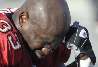 TAMPA, FL - DECEMBER 28: Fullback Jameel Cook #33 of the Tampa Bay Buccaneers ponders a failed playoff bid and an injury to running back Carnell Williams against the Oakland Raiders at Raymond James Stadium on December 28, 2008 in Tampa, Florida.  (Photo by Al Messerschmidt/Getty Images)
