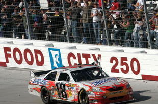 BRISTOL, TN - MARCH 22:  Kyle Busch, driver of the #18 Snickers Toyota, celebrates winning the NASCAR Sprint Cup Series Food City 500 at Bristol Motor Speedway on March 22, 2009 in Bristol, Tennessee.  (Photo by Jerry Markland/Getty Images for NASCAR)
