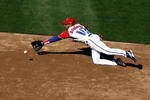 SAN DIEGO - MARCH 15: Yulieski Gourriel #10 of Cuba dives for a ground ball during the 2009 World Baseball Classic Round 2 Pool 1 match on March 15, 2009 at Petco Park in San Diego, California.  (Photo by Donald Miralle/Getty Images)