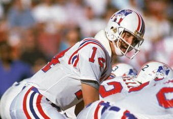 LOS ANGELES - NOVEMBER 26:  Quarterback Steve Grogan #14 of the New England Patriots calls the count during a NFL game against the Los Angeles Raiders at LA Memorial Coliseum on November 26, 1989 in Los Angeles, California .  The Raiders defeated the Pats 24-21.  (Photo by Ken Levine/Getty Images)