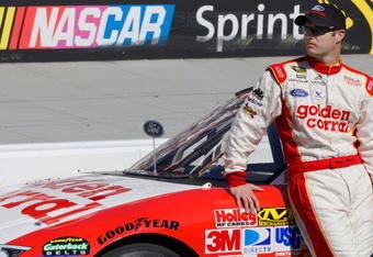 BRISTOL, TN - MARCH 20:  Travis Kvapil driver of the #28 Golden Corral Ford stands on pit road during qualifying for the NASCAR Sprint Cup Series Food City 500 at Bristol Motor Speedway on March 20, 2009 in Bristol, Tennessee.  (Photo by John Harrelson/Getty Images)