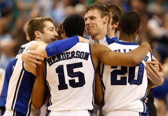 GREENSBORO, NC - MARCH 21:  Greg Paulus #3 and Martynas Pocius #5 of the Duke Blue Devils congratulate Gerald Henderson #15 and Elliot Williams #20 after their 74-69 win over the Texas Longhorns during the second round of the NCAA Division I Men's Basketball Tournament at the Greensboro Coliseum on March 21, 2009 in Greensboro, North Carolina.  (Photo by Streeter Lecka/Getty Images)