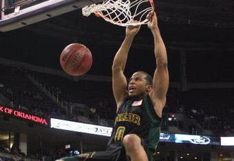 OKLAHOMA CITY - MARCH 08:  Curtis Jerrelis #0 of the Baylor Bears dunks as Darryl Butterfield #35 lof the Missouri Tigers looks on during the first round of the Phillips 66 Big 12 Men's Basketball Championship on March 8, 2007 at the Ford Center in Oklahoma City, Oklahoma.  (Photo by Jamie Squire/Getty Images)