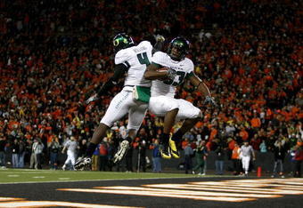 CORVALLIS, OR - NOVEMBER 29:  Ed Dickson #83 of the Oregon Ducks celebrates with Jaison Williams #4 after scoring a touchdown  against the Oregon State Beavers at Reser Stadium on November 29, 2008 in Corvalis, Oregon.  (Photo by Jonathan Ferrey/Getty Images)