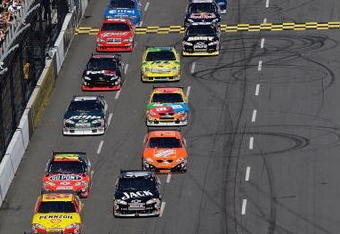 MARTINSVILLE, VA - OCTOBER 19: Jimmie Johnson driver of the #48 Lowe's Chevrolet and Jeff Burton driver of the #31 AT&T Mobility Chevrolet leads the field into turn after taking taking the green flag to start the NASCAR Sprint Cup Series TUMS QuikPak 500 at Martinsville Speedway on October 19, 2008 in Martinsville, Virginia.  (Photo by John Harrelson/Getty Images for NASCAR)