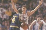 6 Apr 1992:  Forward Chris Webber of the Michigan Wolverines tries to fend off center Christian Laettner of the Duke Blue Devils during a playoff game at the Hubert H. Humphrey Metrodome in Minneapolis, Minnesota.  Duke won the game 71-51. Mandatory Credit: Jonathan Daniel  /Allsport