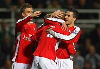NEWCASTLE, UNITED KINGDOM - MARCH 21:  Abou Diaby of Arsenal is congratulated by his team mates after scoring his team's second goal during the Barclays Premier League match between Newcastle United and Arsenal at St James' Park on March 21, 2009 in Newcastle, England.  (Photo by Julian Finney/Getty Images)