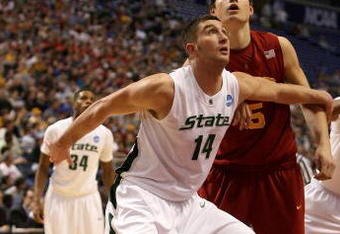 MINNEAPOLIS - MARCH 22:  Goran Suton #14 of the Michigan State Spartans fights for position under the basket against Nikola Vucevic #5 of the USC Trojans during the second round of the NCAA Division I Men's Basketball Tournament at the Hubert H. Humphrey Metrodome on March 22, 2009 in Minneapolis, Minnesota. Michigan State won 74-69. (Photo by Jonathan Daniel/Getty Images)