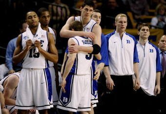 BOSTON - MARCH 26:  The Duke Blue Devils sit dejected on their bench after losing to the Villanova Wildcats during the NCAA Men's Basketball Tournament East Regionals at TD Banknorth Garden on March 26, 2009 in Boston, Massachusetts.  (Photo by Elsa/Getty Images)
