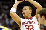 KANSAS CITY, MO - MARCH 21:  Taylor Griffin #32 of the Oklahoma Sooners sets up to shoot the free throw against the Michigan Wolverines during the second round of the NCAA Division I Men's Basketball Tournament at the Sprint Center on March 21, 2009 in Kansas City, Missouri. The Sooners defeated the Wolverines 73-63.  (Photo by Jamie Squire/Getty Images)