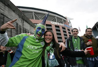SEATTLE - MARCH 19:  Seattle Sounders FC fans celebrate around Qwest Field shortly before the season opener and inaugural game on March 19, 2009 in Seattle, Washington.  Sounders FC faces last season's MLS runners-up, the New York Red Bulls.  (Photo by Robert Giroux/Getty Images)