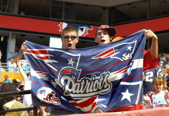 MIAMI, FL - OCTOBER 21: Fans of the New England Patriots display a team flag before play against the Miami Dolphins at Dolphin Stadium on October 21, 2007 in Miami, Florida.  The Pats won 49 - 28. (Photo by Al Messerschmidt/Getty Images) *** Local Caption ***