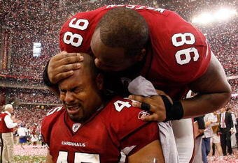 GLENDALE, AZ - JANUARY 18:  Fullback Terrelle Smith #45 and tackle Gabe Watson #98 of the Arizona Cardinals celebrate after the NFC championship game against the Philadelphia Eagles on January 18, 2009 at University of Phoenix Stadium in Glendale, Arizona. The Cardinals defeated the Eagles 32-25 to advance to the Super Bowl.  (Photo by Chris Graythen/Getty Images)
