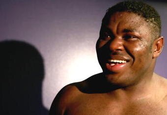 LOS ANGELES, CA - SEPTEMBER 2: Samuel Peter smiles in his locker room after he is declared the winner by split decision after his WBC heavyweight title elimination/NABF & IBA heavyweight championship fight against James Toney at Staples Center on September 2, 2006 in Los Angeles, California. (Photo by Donald Miralle/Getty Images)