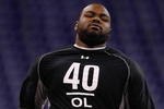 INDIANAPOLIS, IN - FEBRUARY 21:  Offensive lineman Michael Oher of Mississippi runs the 40 yard dash during the NFL Scouting Combine presented by Under Armour at Lucas Oil Stadium on February 21, 2009 in Indianapolis, Indiana. (Photo by Scott Boehm/Getty Images)