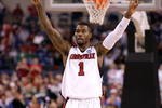 INDIANAPOLIS - MARCH 27:  Terrence Williams #1 of the Louisville Cardinals celebrates on court against the Arizona Wildcats during the third round of the NCAA Division I Men's Basketball Tournament at the Lucas Oil Stadium on March 27, 2009 in Indianapolis, Indiana.  (Photo by Andy Lyons/Getty Images)