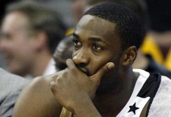 CLEVELAND - APRIL 21:  Gilbert Arenas #0 of the Washington Wizards looks on from the bench late in the game while playing the Cleveland Cavaliers in Game Two of the Eastern Conference Quarterfinals during the 2008 NBA Playoffs at Quicken Loans Arena April 21, 2008 in Cleveland, Ohio. Cleveland won the game 116-86. NOTE TO USER: User expressly acknowledges and agrees that, by downloading and or using this photograph, User is consenting to the terms and conditions of the Getty Images License Agreement.  (Photo by Gregory Shamus/Getty Images)