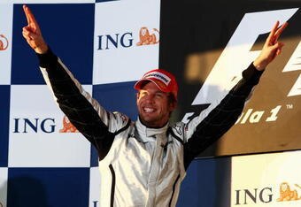 MELBOURNE, AUSTRALIA - MARCH 29:  Jenson Button of Great Britain and Brawn GP celebrates on the podium after winning the Australian Formula One Grand Prix at the Albert Park Circuit on March 29, 2009 in Melbourne, Australia.  (Photo by Clive Mason/Getty Images)