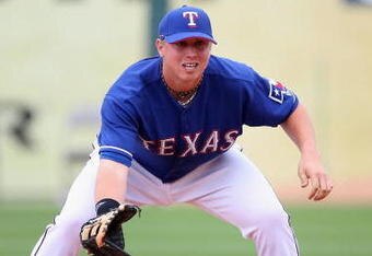 SURPRISE, AZ - MARCH 05:  Justin Smoak #12 of the Texas Rangers in action during the spring training game against the San Diego Padres at Surprise Stadium on March 5, 2009 in Surprise, Arizona. The Rangers defeated the Padres 4-3.  (Photo by Christian Petersen/Getty Images)