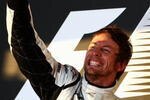 MELBOURNE, AUSTRALIA - MARCH 29:  Jenson Button of Great Britain and Brawn GP celebrates on the podium after winning the Australian Formula One Grand Prix at the Albert Park Circuit on March 29, 2009 in Melbourne, Australia.  (Photo by Clive Mason/Getty Images)