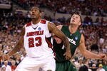 INDIANAPOLIS - MARCH 29:  Terrence Jennings #23 of the Louisville Cardinals positions himself for a rebound against Goran Suton #14 of the Michigan State Spartans during the fourth round of the NCAA Division I Men's Basketball Tournament at the Lucas Oil Stadium on March 29, 2009 in Indianapolis, Indiana.  (Photo by Andy Lyons/Getty Images)