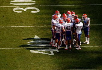 KNOXVILLE, TN - SEPTEMBER 20:  Head coach Urban Meyer of the Florida Gators talks to his team on the sidelines against the Tennessee Volunteers during their game at Neyland Stadium on September 20, 2008 in Knoxville, Tennessee.  (Photo by Streeter Lecka/Getty Images)