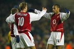 LONDON - DECEMBER 10:  Thierry Henry of Arsenal celebrates with Dennis Bergkamp and  Fredrik Ljungberg after Fredrik Ljungberg scored the second goal for Arsenal during the UEFA Champions League Group B match between Arsenal and Lokomotiv Moscow at Highbury on December 10, 2003 in London.  (Photo by Ben Radford/Getty Images)
